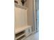 Cozy mudroom with a built-in bench, storage cabinets, and shoe rack at 42211 Edgewater Dr, Punta Gorda, FL 33982