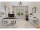 Bright home office with a large window, modern desk, and neutral decor at 42211 Edgewater Dr, Punta Gorda, FL 33982