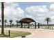 Waterside pavilion provides shade, seating, and lake views in a picturesque setting at 42211 Edgewater Dr, Punta Gorda, FL 33982
