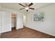 Bright bedroom with wood-look flooring, a closet, and a window providing natural light at 4225 Empire Pl, Tampa, FL 33610