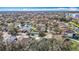Aerial view of a neighborhood featuring lush landscaping, serene ponds, and well-maintained homes at 4441 Fieldview Cir, Wesley Chapel, FL 33545