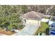 View of the house showing the roof, driveway, 2 car garage and parts of the surrounding lawn at 4441 Fieldview Cir, Wesley Chapel, FL 33545