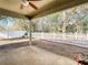 Spacious backyard showcasing a charming white picket fence and a patio area at 4441 Fieldview Cir, Wesley Chapel, FL 33545