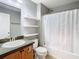 Well-lit bathroom with a single sink vanity and a shower-tub combo at 4441 Fieldview Cir, Wesley Chapel, FL 33545