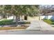 Exterior view of house on a sunny day, landscaped yard, driveway and 2 car garage at 4441 Fieldview Cir, Wesley Chapel, FL 33545