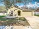Charming single-story home featuring a two-car garage, and a well-maintained front yard with mature trees at 4441 Fieldview Cir, Wesley Chapel, FL 33545
