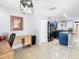 Kitchen view leading to office space, featuring blue cabinets and stainless steel appliances at 4441 Fieldview Cir, Wesley Chapel, FL 33545