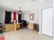Spacious home office with neutral walls, tile flooring, and a large built-in wooden desk at 4441 Fieldview Cir, Wesley Chapel, FL 33545