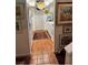Galley kitchen featuring white cabinets, tile floor, and charming decor at 5231 Bayshore Blvd # 10, Tampa, FL 33611