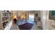 Serene main bedroom featuring a comfortable bed, bookshelf, and private balcony access at 5231 Bayshore Blvd # 10, Tampa, FL 33611
