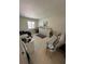 Versatile office space with great natural light and a comfortable futon couch at 5231 Bayshore Blvd # 10, Tampa, FL 33611