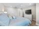 Serene bedroom featuring wood-look tile flooring, neutral colors, with a ceiling fan and closet at 5351 Bridge St # 71, Tampa, FL 33611
