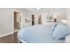 Beautiful bedroom shows ensuite bathroom, ceiling fan, and hardwood floors at 5351 Bridge St # 71, Tampa, FL 33611