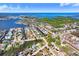 Wide aerial view of single-story house in established residential neighborhood near the water at 5510 Berlin Dr, Port Richey, FL 34668
