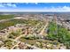 Wide aerial view of single-story house in wooded neighborhood at 5510 Berlin Dr, Port Richey, FL 34668