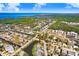 Wide aerial view of single-story house in established residential neighborhood near beach at 5510 Berlin Dr, Port Richey, FL 34668