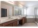 Primary bathroom with double sink vanity, large soaking tub and tile shower at 5934 Maidenstone Way, Palmetto, FL 34221