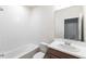 Bathroom with a shower-tub combo, modern fixtures, and a white vanity with wooden cabinets at 5934 Maidenstone Way, Palmetto, FL 34221