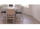 Cozy dining area features a round table with seating for four near bay window at 5934 Maidenstone Way, Palmetto, FL 34221