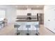 Open kitchen showcases modern stainless steel appliances and an island with bar seating at 5934 Maidenstone Way, Palmetto, FL 34221