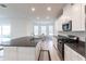 Well-lit kitchen with island featuring stainless steel appliances and breakfast nook at 5934 Maidenstone Way, Palmetto, FL 34221
