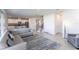 Spacious living room features tile floors, a comfortable sofa, and a staircase at 5934 Maidenstone Way, Palmetto, FL 34221