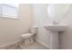 Bright powder room boasts a pedestal sink and neutral decor at 5934 Maidenstone Way, Palmetto, FL 34221