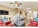 Open living room featuring stairs, hardwood floors, and view of the kitchen area at 6042 54Th N St, St Petersburg, FL 33709