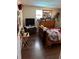 Bedroom featuring wood-look flooring, a window with natural light, and a cozy atmosphere at 6107 Montana Ave, New Port Richey, FL 34653