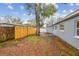 Large, fenced backyard featuring mature trees, providing ample shade and privacy at 7030 19Th N Way, St Petersburg, FL 33702