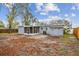 Large backyard features a screened patio, storage shed, and wood privacy fence at 7030 19Th N Way, St Petersburg, FL 33702