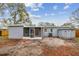 Backyard features a screened in patio, air conditioning condenser, and outdoor storage at 7030 19Th N Way, St Petersburg, FL 33702