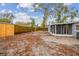 Backyard features a screened patio, mature trees, and a wood privacy fence at 7030 19Th N Way, St Petersburg, FL 33702