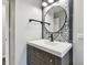 Beautiful bathroom featuring a vanity with a modern faucet, mirror, and decorative backsplash at 7030 19Th N Way, St Petersburg, FL 33702