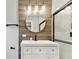 Stylish bathroom featuring a modern vanity with black faucet and a beautifully tiled shower with a black framed glass door at 7030 19Th N Way, St Petersburg, FL 33702
