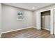 Well-lit bedroom featuring fresh paint, a window and a spacious closet for storage at 7030 19Th N Way, St Petersburg, FL 33702