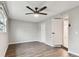 A well lit bedroom features laminate flooring, modern ceiling fan, and bright natural light at 7030 19Th N Way, St Petersburg, FL 33702