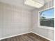 Dining room featuring wood floors, modern chandelier, and decorative paneled walls at 7030 19Th N Way, St Petersburg, FL 33702