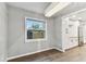 Bright dining room with wood floors, modern chandelier, and view to the kitchen at 7030 19Th N Way, St Petersburg, FL 33702