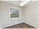 Dining room with wood floors, modern chandelier, and decorative paneling on the walls at 7030 19Th N Way, St Petersburg, FL 33702