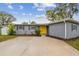 Charming single-story home featuring a well-maintained front yard and painted brick facade at 7030 19Th N Way, St Petersburg, FL 33702