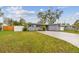 Charming single-story home featuring a well-maintained front yard and painted brick facade at 7030 19Th N Way, St Petersburg, FL 33702