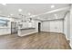 Modern kitchen featuring stainless steel appliances, granite countertops, and hardwood floors at 7030 19Th N Way, St Petersburg, FL 33702