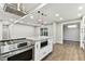 Bright kitchen featuring an island with granite countertop and stainless steel appliances at 7030 19Th N Way, St Petersburg, FL 33702