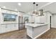 Newly renovated kitchen with stainless steel appliances, granite countertops, and modern fixtures at 7030 19Th N Way, St Petersburg, FL 33702