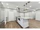 Open concept kitchen with stainless appliances, granite countertops, and a modern range at 7030 19Th N Way, St Petersburg, FL 33702