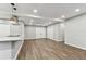 Open floorplan with hardwood floors connecting the kitchen to the rest of the house at 7030 19Th N Way, St Petersburg, FL 33702