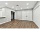 Bright living room with modern flooring, neutral paint, recessed lights, and a double closet at 7030 19Th N Way, St Petersburg, FL 33702
