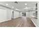 Open concept floorplan features a living area and kitchen with stainless steel appliances and a large sliding glass door at 7030 19Th N Way, St Petersburg, FL 33702