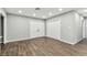 Bright living room with modern flooring, neutral paint, recessed lights, and a double closet at 7030 19Th N Way, St Petersburg, FL 33702